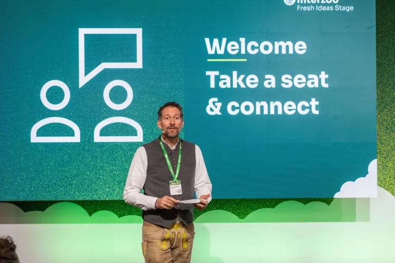 The moderator welcomes the audience to the Fresh Ideas Stage