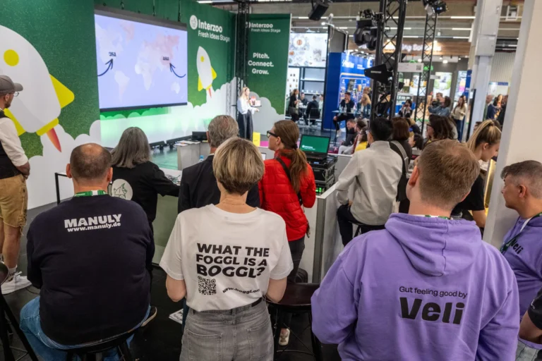 Packed audience in front of the Fresh Ideas Stage during a pitch